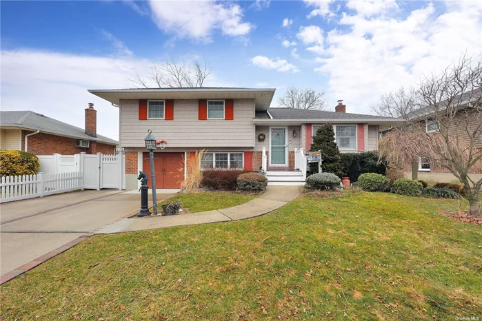 Beautiful, well maintained Expanded Split situated on quiet mid-block, prestigious Plainedge SD #18, great curb appeal w/brick & vinyl sided ext., new Trex stoop & steps w/PVC railings, double cement driveway w/Belgium blocks, LR w/refinished h/w floors, crown & dental moldings & window seat, FDR w/refinished h/w floors, updated EIK w/new quartz countertops, stone backsplash, vaulted ceiling, 2 skylights, beam ceiling, h/w floors, brand new dishwasher & sliding French doors to beautiful rear screen Porch, Upper Level 3 Bedrooms w/refinished h/w floors, Full Bath w/Jacuzzi tub & skylight, pull down Attic w/hide-away stairs, 1st Floor garage conversion to LR, Entertainment Center, Full Bath w/tin ceiling, Laundry Room w/washer & dryer, Basement part finished, Bedroom w/walk-in closet, Office, Mud Rm, all newer Andersen windows, CAC, gas & separate hot water heater only 10 years old, 150 amp electric, priv. fenced backyard, covered patio, gazebo, convenient to all transportation & shopping.