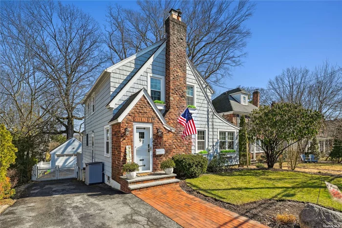 Impressive colonial home boasting a charming side hall design, characterized by a warm and inviting open floor plan flooded with abundant natural light. Ideal for cozying up beside a wood-burning fireplace during chilly evenings. Situated in close proximity to the long island rail road, Pine street park, and Main Street. Notable features include, office,  a walk-out out basement, a large 2 car- detached garage, and deep, spacious yard offering ample parking for multiple vehicles. Potential to create a permitted in-law suite.