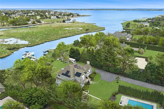 This amazing 4 bedroom, 4 bathroom Post Modern home has everything you could want for your Hamptons retreat! Build in 2012 and fully equipped with geothermal heating/cooling, solar panels, and 4 Tesla powerwalls, the interior is beautifully finished and has water views from nearly every room. The home boasts primary suites on both the 1st and 2nd floors, gourmet kitchen, third story deck with hot tub, 6 car garage, and home gym. The heated pool is beautifully landscaped for ultimate privacy. Deep water dock with water and 50 amp elctrical service easily accommodates boats up to +/- 45&rsquo; with ease of access to Moriches Bay, along with two floating docks, and a double jetski dock. Just minutes from Westhampton Beach Village with boutique shopping, restaurants, and the Performing Arts Center and Dune Road&rsquo;s world-class beaches!