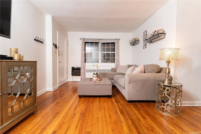 Welcome Home to Hollis Court! This Sunny First Floor Garden Apartment Features Hardwood Floors and an Updated Kitchen & Bathroom, Large Bedroom & Lots of Closets. Move Right In. Near Schools, Shops & Transportation.