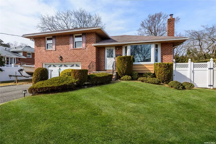 This charming brick split-level residence offers a perfect blend of comfort and convenience in the heart of Syosset. Boasting 3-4 bedrooms and 1.5 baths, this property is an ideal choice for those seeking a warm and inviting space. Conveniently located close to the LIRR, houses of worship, shopping centers and schools. This home ensures that every essential amenity is just moments away. The strategic mid-block position provides a tranquil setting, creating a peaceful oasis within a bustling town. Step inside to discover a well-thought-out layout designed for entertaining. The spacious bedrooms provide a retreat-like atmosphere, complemented by ample closet space for all your storage needs. The 2-zone gas heating system, new hot water tank, and upgraded electric components ensure a modern and efficient living environment. Enjoy the comfort of 1-zone central air-conditioning throughout the home, providing a respite from the summer heat. The finished basement adds an extra layer of versatility, offering space for a recreation room, home office, or additional living quarters. Hardwood flooring graces the interior, adding a touch of elegance and easy maintenance. Eat in-kitchen equipped to handle your daily needs and perfect for hosting gatherings. With a 2-car garage parking is a breeze, adding convenience to your daily routine. One of the highlights of this property is the wonderful flat yard measuring 70x102. This outdoor space is a blank canvas ready for your gardening ideas, playsets or outdoor entertaining. Embrace the opportunity to make this house your home with TLC. The potential is limitless and features are designed to accommodate a variety of lifestyles. Sold as-is. Don&rsquo;t miss the chance to call this residence your own!