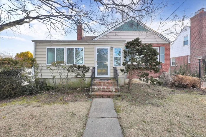 Spacious Cape with 6 rooms 3 beds and 2 bath located in Malverne school district. Large Livingroom with fireplace, Hardwood floors as seen and 1 car detached garage. Close to shopping, transportation and major roadways.