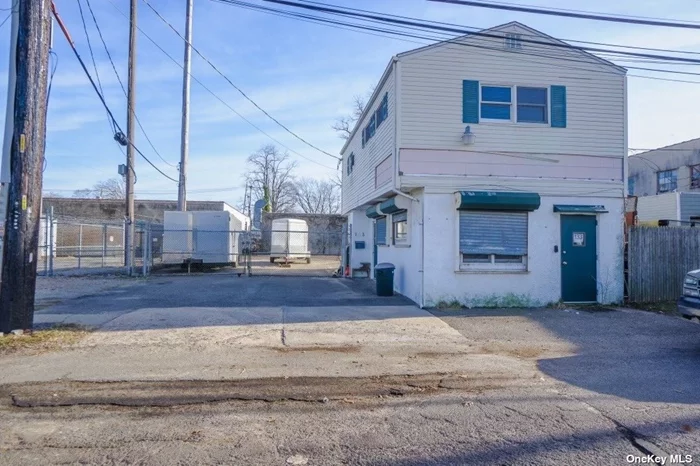 Very unique Multi use property that offers a range of opportunities with multiple sources of income. 1st floor is a renovated commercial space with full bath. 2nd floor is a 1 bedroom apartment that can easily be converted into a 2 bedroom. Expansive parking for rental opportunists. Dont Miss Out On This Prime Investment Opportunity!!!