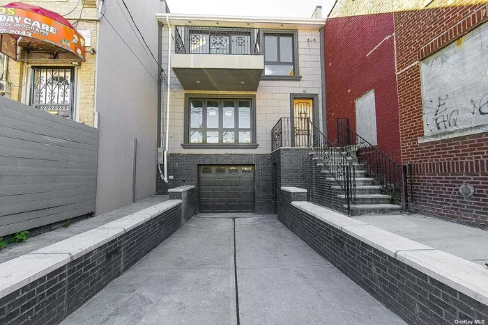 Discover this fully renovated, modern open-style home in North Cypress Hills, Brooklyn. Features a private parking-garage, 24x46 (1104 sqf per floor) building size in R5 zoning, two full baths on each floor,  a full finished walk-out basement with a half bath boasting separate front and back entrance, a big fenced-in yard, and skylight through out the second floor,  this property offers unparalleled conform and style.
