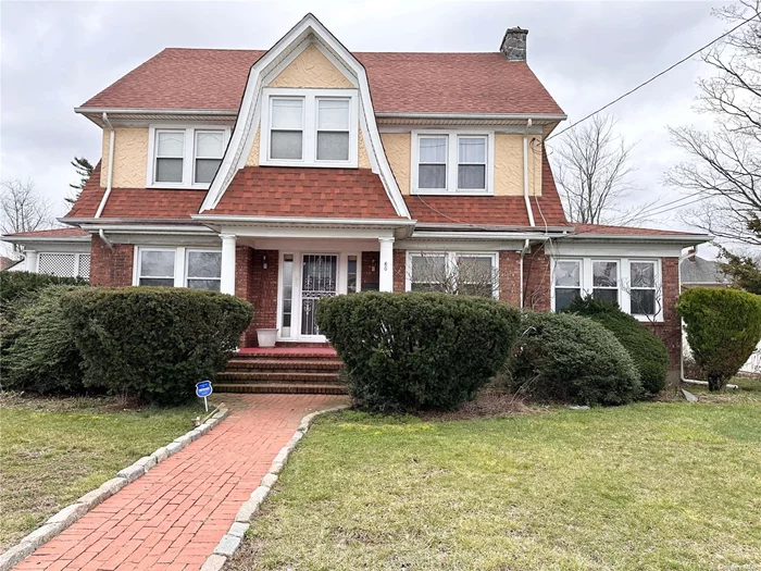 All brick colonial home in the heart of Hempstead. Oversized bedrooms, 1.5 baths, hardwood floors, full basement, full living room, formal dining room, updated kitchen, pantry, and detached three car garage with a long driveway. Ample of parking. Close to LIRR, bus, shops, park, schools, and all amenities.