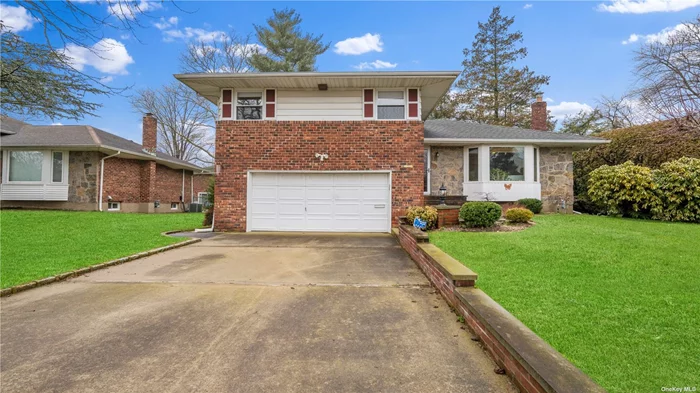 Welcome to this meticulously maintained three-bedroom split-level home that seamlessly blends modern updates with classic comfort. Step inside to discover beautiful wood floors that add warmth and character to the living spaces. The heart of the home features a spacious eat-in kitchen, featuring gas cooking, perfect for culinary creations and entertaining, while the central air conditioning ensures comfort year-round. The lower level is finished with perfect use of the space for additional office space, and potential playroom. With a two-car garage offering ample parking and storage, as well as convenient access to gas utilities, this home offers both modern convenience and timeless appeal. Come and experience the perfect harmony of contemporary living in a classic setting. Buyers need to confirm all info contained herewithin