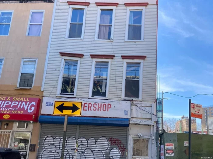 Three story building with one storefront and two residential units. Zoning C-4-4L. Need work.. Excellent opportunity for investors and developers.