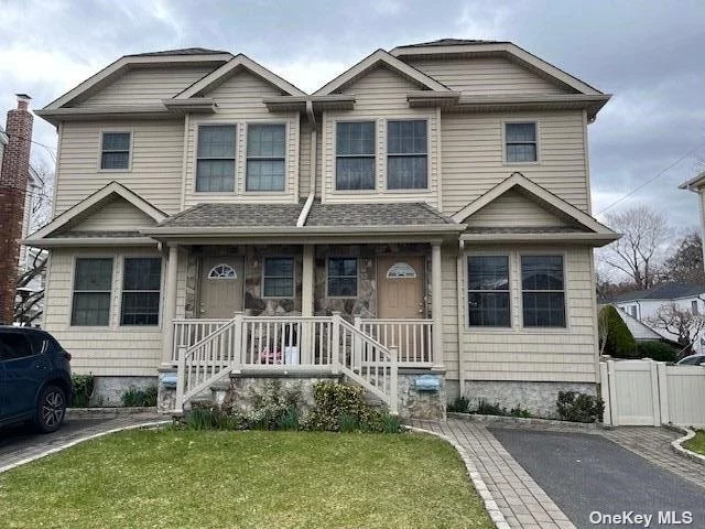 Three Bedroom Apartment with Backyard. Kitchen with Both Island and Eat-In-Area for Table. Hardwood Floors Throughout. Basement has OSE to Backyard.