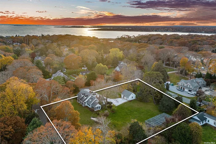 Located on one of the most desirable lanes in the Hamlet of Remsenburg, this charming, meticulously maintained expanded Cape style home is situated on 1.33 +/- acres near Moriches Bay. The interior has a special character typical of cottages built in the 1920&rsquo;s, with rich wide-plank hardwood floors and many period details. The 1st floor includes 3 bedrooms, 3 baths, a spacious living room with fireplace, a media room with built-in bookcases, and a formal dining room which opens to a screened porch. Significant improvements include the addition of a 2nd floor primary suite, kitchen and bath updates, and restoration of the front, back and screened porches. The property includes a detached, over-sized 2-car garage with a garden workshop, and an irrigated, screened cutting garden. There is plenty of room for expansion and the addition of a swimming pool. The home is close to the Village amenities of Westhampton Beach and Eastport, moments from beaches, restaurants, and less than 80 miles from NYC, making this an opportunity not to be missed.