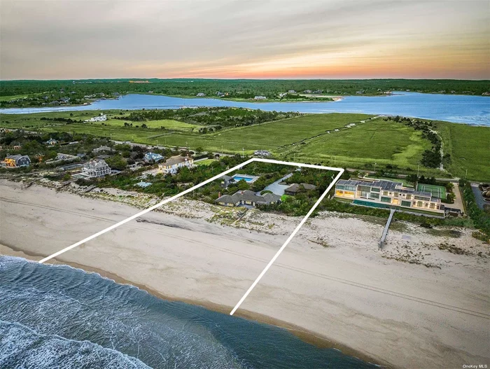 Nestled within the coveted enclave of Quogue, where sophistication meets the serenity of the ocean, this stunning oceanfront property presents a rare opportunity for those seeking the pinnacle of coastal luxury living. Situated on approximately 2.3 acres of prime real estate, this estate commands an impressive stretch of +/- 231 feet of private beach frontage, offering unparalleled access to the pristine sands and azure waters of the Atlantic. The centerpiece of this magnificent estate is the main house, boasting four bedrooms and three and a half bathrooms. Renovated by the esteemed builder George Vickers, every inch of this residence exudes timeless elegance and impeccable craftsmanship. Step inside to discover a world of culinary delight in the professional chef&rsquo;s kitchen. Here, a Wolf 8-burner range with double oven stands as the centerpiece, inviting culinary creations to unfold with ease. A full-size side-by-side refrigerator and freezer offer ample storage for farm-fresh produce and artisanal delights, while a sleek wine cooler ensures that every bottle is kept at the perfect temperature. At the heart of it all, a sprawling center island beckons, providing both a practical workspace and a gathering place for friends and family to indulge in epicurean delights. In the living area, a wood-burning fireplace casts a warm glow, creating an ambiance of cozy sophistication that invites relaxation and conversation.   Complementing the main residence is a charming two-bedroom guest cottage, offering a secluded retreat for visitors or additional space for family and friends. Perched above the picturesque 20x40 gunite pool, the cottage provides a tranquil haven where guests can unwind and indulge in the beauty of their surroundings. Outside, a spacious deck surrounds the pool, providing the perfect setting for al fresco entertaining or simply soaking up the sun in style. Whether hosting lavish gatherings under the starlit sky or enjoying quiet moments of relaxation by the water&rsquo;s edge, this outdoor oasis is a true haven for those who appreciate the finer things in life. With its unparalleled location, luxurious amenities, and endless potential for customization, this oceanfront estate epitomizes the essence of coastal living at its finest. Whether you seek a serene escape from the hustle and bustle of city life or yearn to create cherished memories with loved ones, this Quogue haven offers the perfect canvas for your dream oceanfront lifestyle.