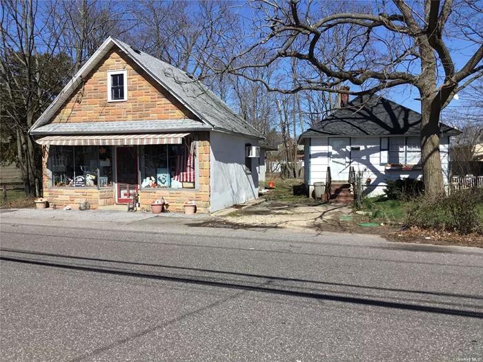 Great Investment Opportunity. Commercial Storefront Building & Small House on Street to Street Property. Both Structures are dated and in need of repair