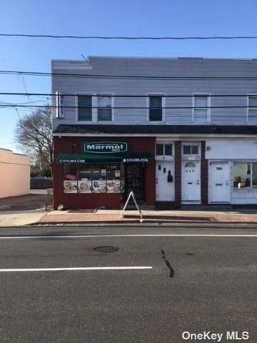 Great location Mixed used property, Front store Deli plus upstairs 4 Bedrooms, Living Room, EIK, 1 full bath Apartment. 1250 SF each Unit. Business Deli is leased (10 Years), 4 Parking spaces.