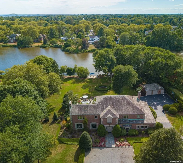 Located in O-Conee Association, one of the South Shore&rsquo;s most desirable waterfront communities, this magnificent brick English Manor lakefront estate is situated on 2 acres of property overlooking O-Conee&rsquo;s scenic Manatuck Lake. Enjoy year-round views and lakeside recreation including fishing, row boating, kayak/paddle boarding, ice skating and pond hockey. O-Conee, a private home owners association, offers its residents exclusive amenities including 2 marinas, a private bayfront beach, private security, back door garbage service, etc... Custom built in 1955, this 6700 sq. ft. home was designed as a classic countyside English manor with large open-space rooms, high ceilings, intricate millwork, hardwood floors, sweeping staircase and large windows throughout to maximize lake views. The Dining Room features centuries-old floor-to-ceiling hand-carved, rift and quartered English oak woodwork. The 11-foot Living Room fireplace features the same PRICELESS carved wood. The property features 2 acres of lush landscaping, blue stone patios, estate fencing,  16&rsquo; round cement/brick grotto with fountain, 2.5 car garage, lakeside patio, etc... O-Conee&rsquo;s Yacht Club marina is just steps away with quick access to the Great South Bay and Fire Island!!! X Flood Zone.