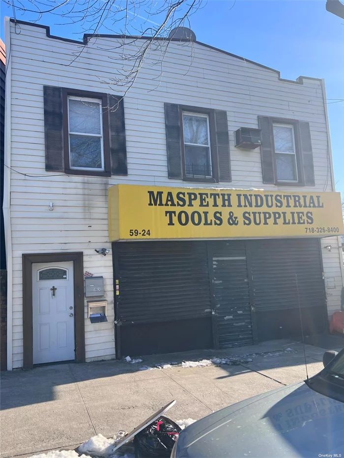 This mixed use property is in a commercial/residential neighborhood. The first floor consists of a store, which presently is vacant with 2 - 1/2 Baths and a 2 BR Apartment on the second floor. The store can be accessed from the front or rear, and the store can be divided into 2 separate rentals.