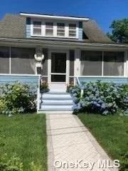 Charming 2 bedroom cape with screened in front porch and big back yard. Private beach rights, near to all.