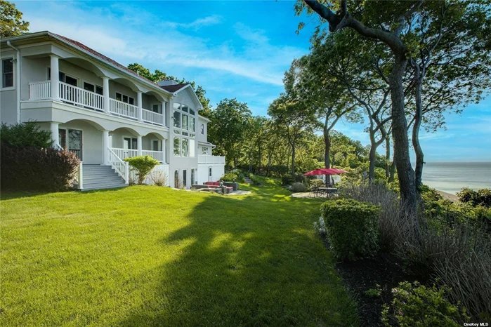 Stunning waterfront location with striking panoramic views of Long Island Sound and the Connecticut coastline. Elevated viewing platforms unique to this property allow for sunset cocktails or sunrise coffees at bluffs edge. Rolling lawns and beautiful gardens accentuate this stunning setting. Dramatic front entry welcomes you immediately with breathtaking views and a sense of calm and quality. This well constructed home completed in 2002 was designed with 3 levels of living and water views from nearly every room. All common rooms are tastefully appointed and welcoming. A handsome custom kitchen with all thermador appliances and expansive center island opens to outdoor deck. Offering an en suite main level bedroom and primary suite with private balcony on 2nd floor along with 2 spacious bedrooms sharing Jack and Jill bath, this floor plan will work for many different needs. A beautifully finished lower level both walkout and water view. This is a rare opportunity to own a majestic waterfront property with a commanding 80 foot elevation of unobstructed water views to enjoy through all seasons. Port Jefferson Country Club with renowned golf course, restaurant and tennis is just steps away, Historic Village offers unique restaurants, shops & parks including McAllister Park, 113 acres of scenic waterfront property in your backyard! PJ is also Home to the Bridgeport-Port Jefferson Ferry -Service to New England! Village Amenities include parking privileges, private beaches and more. Port Jefferson is the smart alternative to the Hamptons and gateway to the North Fork!
