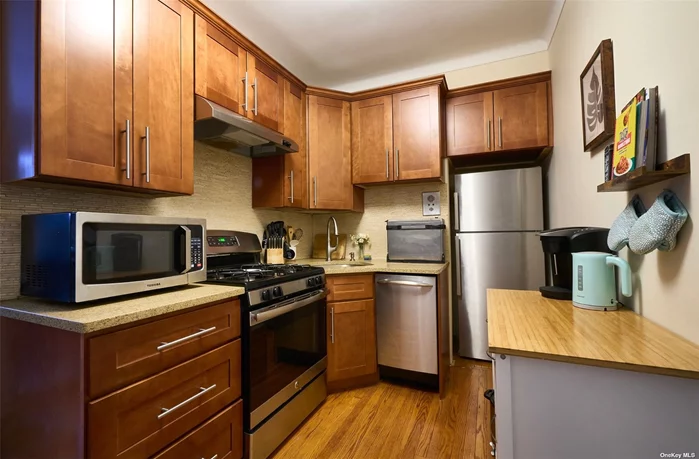 Junior 1BR with Garden Views. Welcome to The Parkview at Forest Hills South. This beautifully renovated, large studio has been thoughtfully converted and used as a one bedroom. As you enter you are greeted with a fully renovated, large kitchen featuring stainless steel appliances including a dishwasher, stove, and refrigerator, granite counter tops and sandstone mosaic backsplash. Beautiful hardwood floors through. Enjoy dinners in your centrally placed dining area with step-up living room. Apartment faces south with excellent light through five windows. Dressing area doubles as a small home office. Best of all is your huge bedroom that can accommodate a king-sized bedroom set. Windowed bathroom was tastefully done in black and white subway-style tiles. This one won&rsquo;t last. Forest Hills South is a prewar jewel with seven beautifully maintained doorman buildings, gardens, fountains and benches, a new gym, bike/storage rooms, community and children&rsquo;s rooms, and adult reading room with workstations and Wi-Fi. The large laundry room has new equipment. Garage parking is wait-listed. Express subway (E, F) and buses are one block away. LIRR Kew Gardens station is 1/2 mile distant (Penn Station in 15 minutes). Excellent shopping and amenities are in the immediate vicinity, with extensive dining and entertainment on nearby Austin Street. The spectacular Forest Park is nearby and offers outstanding recreation and outdoor activities.