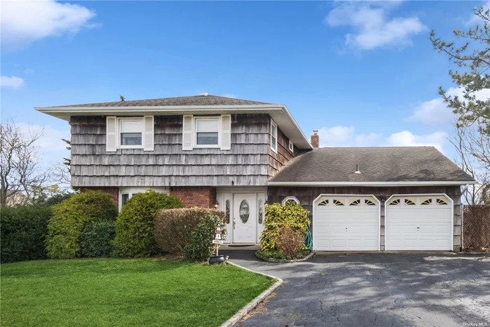 Just in Time for Summer! Beautifully Maintained Splanch Home Nestled on a 0.27Acre Corner Lot with breathtaking views of the Great South Bay and Canal in Captree Landings of West Islip. A Spacious Entry Foyer Greets You Upon Entering with a Formal Dining Room, Eat-in-Kitchen, Mudroom, Half Bath and Cozy Den Area with Sliders Leading out into the Spacious Backyard. Refinished Harwood Floors as Seen Throughout House. Upper Level to First Landing is your Overly Spacious Living Room Area with Sliding Doors Leading onto the Deck that Overlooks the Canals and Bay. The Upper Level Features Four Bedrooms, Primary Bedroom Featuring en-suit Bathroom, Walk-In Closet & Sliders Leading out to the Deck Perfectly Overlooking Water Views of the Great South Bay and Canals. Three Secondary Bedrooms with an Additional Full Bathroom in Hallway. Additionally a Partial Basement that May Be Used as a Recreational Room, Home Office or Turned into an Additional Bedroom. Attached Two-Car Garage with Pull Down Attic Offering Ample Space for Storage.