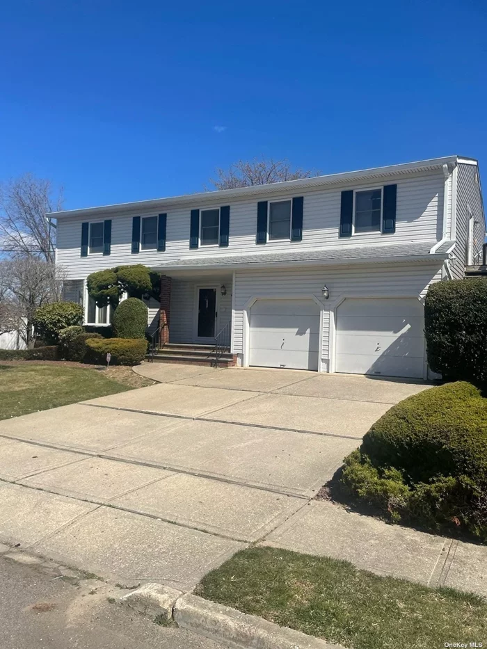 This 2 Family By Permit is A Custom Built Colonial That Has Room Sizes Like You Have Never Seen. Features Tremendous Kitchen With Center Island, Large Family Rm With Sliders to Tremendous Deck, Master Suite With Built in Vanity & Huge Closet, Central Air, Finished Basement. Right in The Heart of Lindenhurst Village.