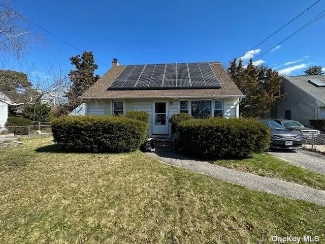 Expanded Cape features 4 bdrms, Sun Porch, All New Thermo Insulated Windows, EIK, HW Floors, Full Basement, Partially Finished, Solar Panels, Leased, Bay Shore SD, Close to Shopping and Transportation, Great Location, Bay Low Taxes. Property Sold As Is.