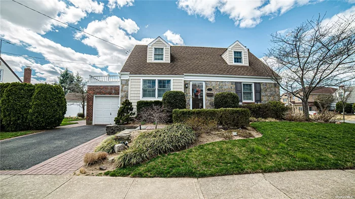 /Welcome to 489 Argyle Road Mineola, a MINT MOVE IN Brick and Fieldstone wide-Line Cape offering the perfect blend of modern comfort and classic charm. This home features 4 Bedrooms and 2 full Baths, adorned with rich oak flooring thru-out. Step into the kitchen, where granite countertops and premium stainless steel appliances elevate the cooking experience. Natural light pours in through Anderson windows, . The spacious basement offers endless possibilities for recreation or storage and incudes a laundry area as well as a free standing gas heating unit and hot water heater The professionally landscaped yard with inground sprinklers and brick patio are perfect for entertaining. Convenient to schools, public transit, shopping, LIRR and all highways, this home also includes a 1 car attached garage .Experience .the best of Mineola living..