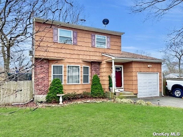 Spacious Colonial Featuring 3 Bedrooms, 1.5 Baths. Large Living Rm, Formal Dining Rm. Den with 1/2 Bath. Hard Wood Floors. Eat in Kitchen w/ Granite Counter Tops and SS Appliances Updated in 2012. Rear Deck. Low Taxes !!!