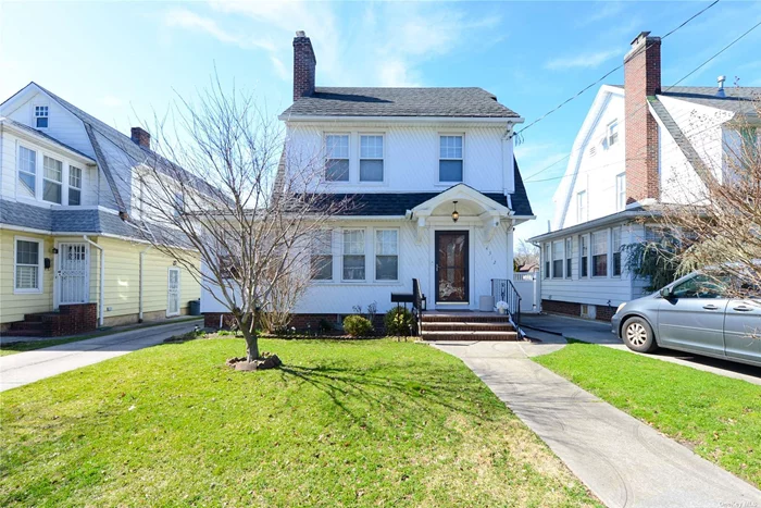 Just arrived - Bright, spacious, and well-maintained colonial with 4 bedrooms, office, and one full and two 1/2 baths. This quiet turnkey home on a one-way street has been upgraded with newer kitchen & appliances, new bathrooms, and newly finished basement. Plenty of storage space in the basement room and attic. Located in prime Flushing neighborhood, just minutes away from Broadway LIRR station and Q12 and Q13 buses, with restaurants, pharmacies, school (P.S. 107), and shopping within blocks. Long private driveway with an electric car charger leads to a detached garage and a wonderful backyard lawn, with a raised garden bed and three fruit trees, bearing peaches, figs, and persimmon. Convenient to all - Won&rsquo;t last!