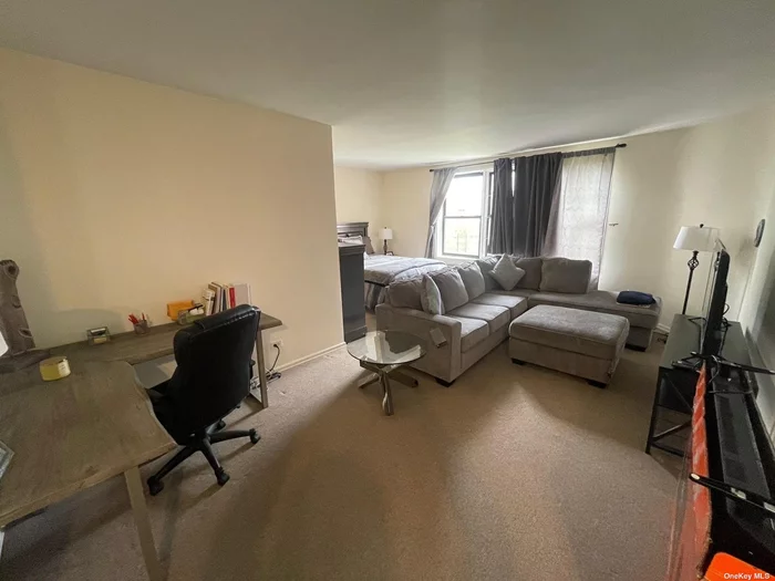 Extra large STUDIO unit with sleeping ALCOVE. Very well managed condo building situated in the heart of Forest Hills and within steps to all shopping and transportation and local train station (R and M trains). Heat and water is included in HOA fees.