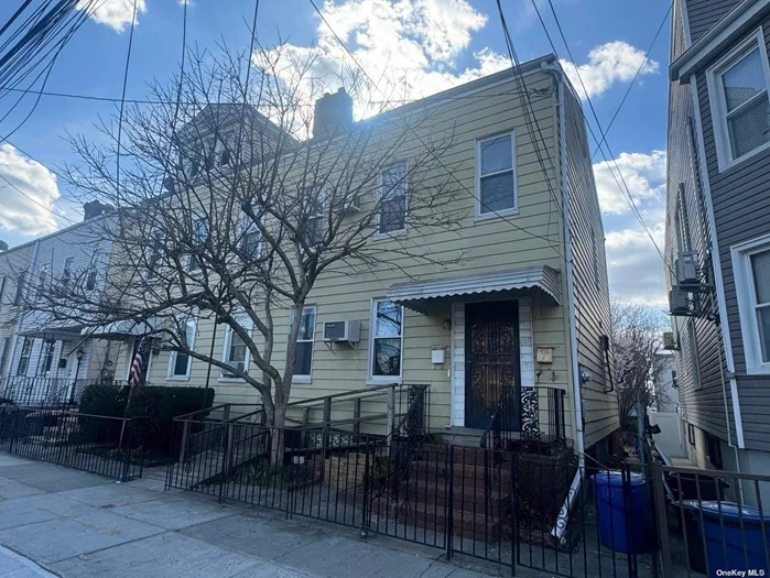 2-family home, 2nd flr has partial views of NYC Skyline,  spacious rooms, Full walk up attic with 12-ft ceilings. Full unfinished basement with rear entrance to yard. New Hot water tank. 1-block to stores and bus.