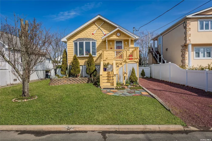 Move right in to this gem by the bay! This home is a real charmer and has a very warm feel. Fantastic location, it is 3 doors from the canal, has a slight bay view, and is 4 doors away from Shore Rd Park. It was completely redone and raised 9 feet in 2014. Light & bright and gets a wonderful breeze in the warmer months. Nice size eat -in-kitchen with newer appliances, double paned windows, vinyl plank floors, 200 amp electric, gorgeous large fenced yard with a multitude of perenials that will keep it blooming spring-fall. Large primary suite with walk-in-closet and tiled bathroom. The den overlooks a covered back deck which is great for entertaining. 4&rsquo; crawl space under the entire house which provides tons of storage. More storage under side and front deck. New owner is required to carry flood insurance. Seller pays $565 per year for flood insurance. 2 window AC units are a gift.