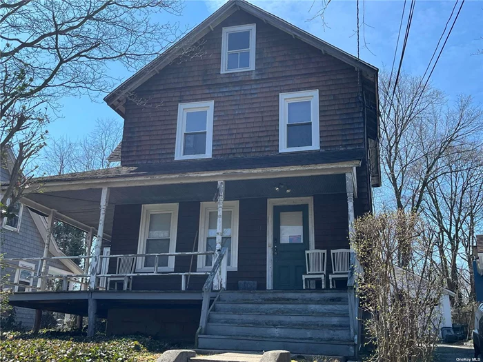 Attention investors. This old charmer that needs a professional. Bring your contractor. It has the possibly to have an accessory apartment. Full basement, walk upstairs to full attic. It has a large 2 car detached garage and taxes under $7000. Needs some TLC, then more TLC. Then more.