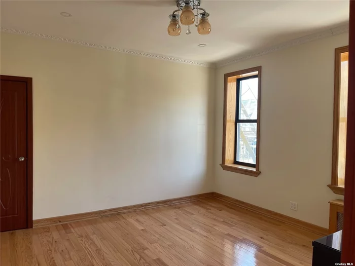 Renovated Unit with Hardwood Floors, Updated Kitchen Appliances, Painted, Top Floor, high ceilings, Convenience, Steps away from shops, Restaurants, Q10 Bus to Airport, Q54 to Trader Joe, Close to Massive Forest Park, LIRR, Walk to Subway, Express Bus to Manhattan, Landlord covers Heat and Hot Water.