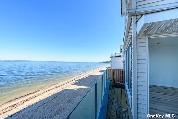 Renovated waterfront home. Absolutely breathtaking view of the Sound.! This is a private beach community! Very bright and sunny. Waterview from Living room and Primary .