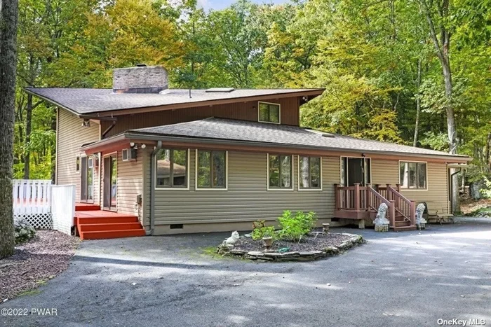 YOUR PRIVATE POCONO GET AWAY! 2.56 ACRES! GORGEOUS VIEWS! MORE THAN 4600 FINISHED SQFT! Behind the gates of the desirable, 4 season community of Hemlock Farms, which includes 4 lakes, 3 pools, tennis, golf & more, find this 3 bedroom (plus 2 bonus bedrooms), 4 bath property set on a quiet cul-de-sac. A freshly painted 1700 SQFT deck offers tons of outdoor entertaining space. A 3 season room offers views of the stunning Fall foliage. New siding & roofing are among the fresh facelift this luxurious property has received. Inside a family room w/ a brick faced, wood burning fireplace, cathedral ceiling, wood ceilings & beams offer the rustic elegance. A huge gourmet kitchen w/ granite, living room, finished basement !