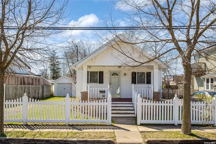 Beautiful Ranch wi/ Front Porch on oversized property 50 x 150 features 2 Bedrooms, , Updated Bathroom, Detached Oversized Garage,  New Hot Water Heater, 150 Amp Service, Updated Windows, Large Yard, Convenient to Train Station, Close to Downtown,  Low Taxes ($6, 804).