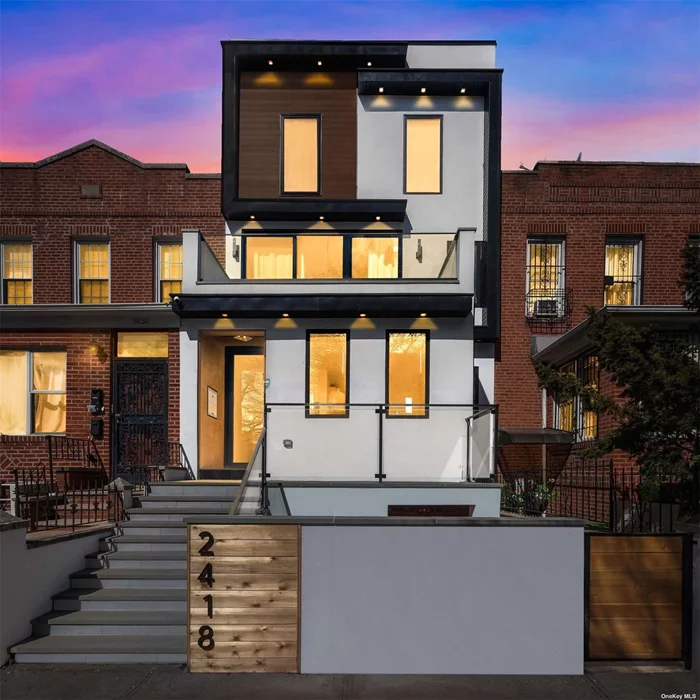 A newly constructed two-dwelling townhouse that marries urban luxury with breathtaking Manhattan skyline views. Situated on the desirable Ditmars side of Astoria, this property is a testament to sophistication and convenience, appealing to those in pursuit of a premier living experience in one of New York&rsquo;s most dynamic neighborhoods. This townhouse spans nearly 4, 000 gross square feet across three meticulously designed floors, blending modern aesthetics with functional living spaces. Every detail has been considered with precision, aimed at the most discerning homeowner. The residence boasts a thoughtful layout to maximize space, functionality, and natural light. It features an open floor plan with high ceilings, smart lighting, heated smart bathroom floors, a smart toilet, a heated towel rack, smart shades, a built-in multi-zone speaker system, wide-plank oak hardwood floors, and floor-to-ceiling windows. The closets, electric gate, and in-unit washer-dryer add layers of comfort and convenience. The kitchen is a chef&rsquo;s delight, equipped with custom European cabinetry, quartz waterfall countertops, under-counter smart lighting, and premium stainless steel Bertazzoni appliances, ensuring both functionality and style. Elevate your lifestyle with the stunning Manhattan skyline views from the roof deck and the master bedroom on the second floor. These panoramic vistas provide a daily backdrop of serenity or sparkling nightlife, depending on the moment. Designed as a two-dwelling townhouse, this property offers flexibility and potential. The fully finished basement introduces an additional layer of luxury, providing ample space for a home office, gym, entertainment area, or a 2-bedroom unit. The craftsmanship and high-quality finishes are consistent and evident throughout every corner of the home.