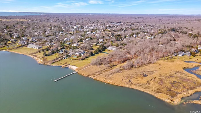 Situated on Bellport Bay and steps from our downtown is a beautiful parcel of land covering 3+ acres of pristine waterfront property. This never before developed parcel offers the most coveted settings that Bellport Village has to offer. Abutting a natural preserve, with spectacular elevated views of the bay this sanctuary offers unmatched waterfront privacy. As you meander down the long winding driveway you will arrive at the entrance of this magnificent wooded setting. Perched 25 feel above sea level, the new home owner will enjoy spectacular views of Bellport Bay, Fire Island and the Atlantic Ocean. With the rights to build a private dock, you can leave your boat in your own backyard. Go out for a morning ride to catch some fish or a sunset cruise for a cocktail! The land invites you to build over 20, 000 square feet of structures. Imagine your new estate with a beautiful luxury home, infinity pool, 4 car garage and tennis courts! The possibilities are endless! Please see attached virtual video tour