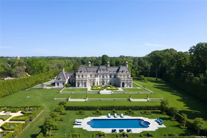 Maison des Jardins, a Versailles-inspired custom-built solid limestone estate, accentuates French Baroque style architecture. The sprawling mansion is spread across two wings, which house a large chef&rsquo;s kitchen, lavish living rooms and drawings rooms complete with wood burning fireplaces and chandeliers, a formal dining room, wet bar, and luxurious primary suite with his/her primary bathrooms & closets.  The residence sits behind 22&rsquo; stately gates, down a quarter mile long treelined driveway and unfolds on over 8 acres of meticulously manicured grounds.