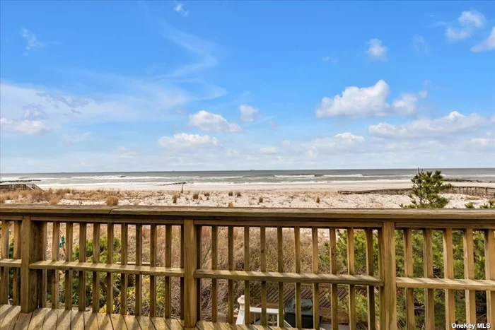 Enjoy the fresh salt air in this magnificent home right on the oceanfront. Amazing views of the Atlantic abound from private decks on all 3 levels, including one right off the primary suite, one on the main level and one right on beach level. The primary suite features a fireplace and a brand new bathroom with radiant heat flooring, and there are 4 additional spacious bedrooms with space to add a sixth. An expansive open-plan living/dining room is full of natural sunlight, and also has a fireplace. The updated kitchen boasts quartz counters and stainless steel appliances with modern cabinetry. A large 53 x 100 buildable lot is attached to the property. Located in the trendy west end, steps away from the beach and the best restaurants and shops in Long Beach.