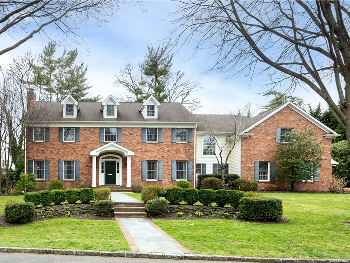 Nestled in the heart of Plandome, this Classic Georgian, Center Hall Colonial invites you in with its timeless elegance. From the graceful 2-story entry to the well-thought-out floor plan, every detail exudes warmth and sophistication. The main level boasts a formal living room with fireplace, elegant dining room, light-filled family room with fireplace, sunroom/office, and a gourmet eat-in kitchen with high-end appliances, center island, custom cabinetry, and granite countertops. Upstairs, discover a dual-entry primary suite, 4 bedrooms, and a rare second-floor entertainment area that offers space for relaxation outside of the bedrooms. Step outside to the oversized bluestone and brick patio and spacious yard, perfect for outdoor gatherings. This property is a true gem. Membership to Plandome Field & Marine with fee.