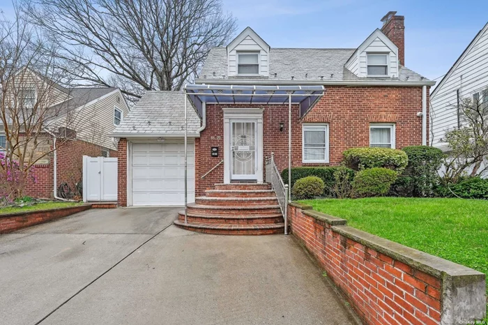 Fully renovated in 2018, we welcome you to this stunning 4 bedroom, 2.5 bath colonial in Holliswood! Upon entering, you will be greeted by an inviting atmosphere, exuding warmth and elegance. All of the main level rooms are connected by strategically placed doorways, creating an open floor plan upon demand. The heart of the home lies in the beautifully renovated eat-in-kitchen, flooded by natural light courtesy of the large picture window and skylights. Step outside to the beautifully landscaped yard, which provides a lovely setting for al fresco dining and outdoor entertaining for all ages. First Floor: Entry foyer, living room with wood-burning fireplace, formal dining room, family room, custom, spacious gourmet kitchen with breakfast area, granite counters and stainless steel appliances, powder room Second Floor: 4 bedrooms, full 4-piece bath Basement: Finished with family room, den/office/guest room, full bathroom, storage, laundry & utilities Additional Features: Attached 1-car garage with interior access, fully finished basement with walk-out to backyard, gas heating system, granite floors in entry foyer and kitchen, all new hardwood floors throughout, custom interior doors & closets throughout the home, large pantry in kitchen, multi-level deck in the backyard, zoned for PS/IS 178 in SD 26!