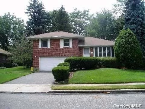 Brick split level home located in Jericho with Syosset schools, four bedrooms, 2.5 baths, gas cooking and heat. Granite kitchen counter tops, lawn care included. Move in mid July