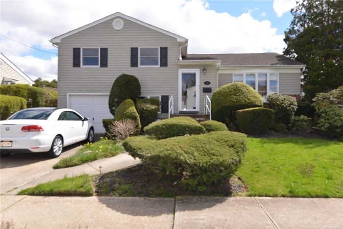 This mid-block expanded split level in the heart of Massapequa Park has everything to offer & more! Located near schools (Massapequa school district #23), shopping, restaurants & transportation, as well as biking, hiking & fishing in the Massapequa Preserve. This home comprises of 3 bedrooms, one of which is an oversized master suite with vaulted callings and skylights, 2.5 bathrooms, eat-in kitchen w/gas stove, finished lower level, Andersen windows throughout, hardwood floors, ADT smart home security system, 200 amps electrical service and a generator hook-up. It is a beautifully landscaped property with large privately fenced backyard, great for entertaining.