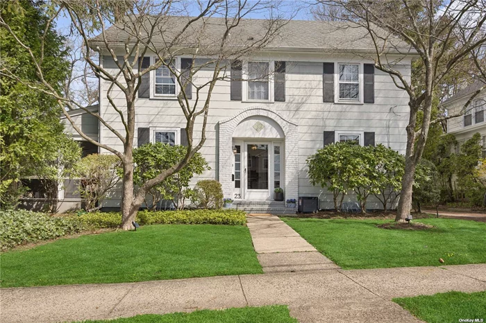 Nestled in a serene mid-block location with captivating water views of Manhasset Bay, this charming 3-bedroom, 1.5-bath Center Hall Colonial offers a perfect blend of classic elegance and modern comfort. Highlights include an oversized living room with a grand fireplace and custom built-ins, a formal dining room, an eat-in kitchen with access to a large private backyard, and a newly renovated detached 2-car garage. The second floor boasts a primary bedroom with a walk-in closet, 2 additional bedrooms, and a full bath, while the third floor features a finished walk-up attic. The large unfinished basement offers bonus bath, laundry, storage, and recreation space. Experience a lifestyle of tranquility and convenience in this exquisite home.  Close distance to park, vibrant town, award winning library & waterfront.