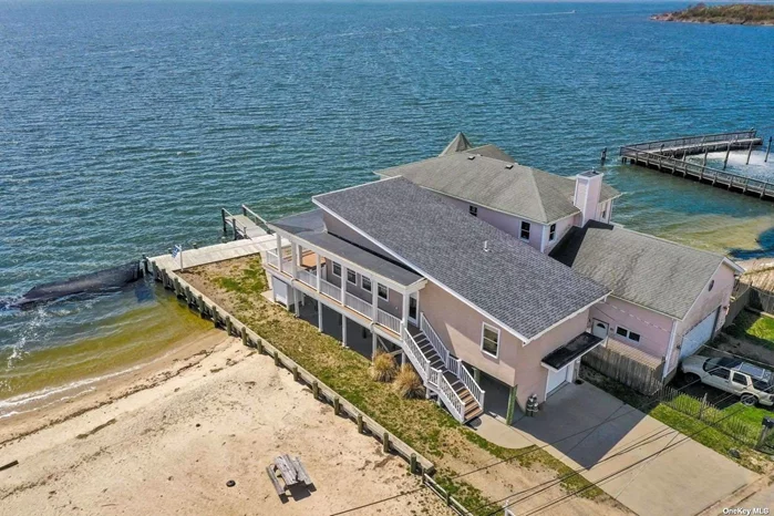 Exquisite Bayfront Chalet with Spectacular Panoramic Views.Home has wide open floor plan with amazing views all the way to Robert moses bridge, fire island Light house., & Jones Beach Theater.. All from your Large wrap around Deck.  Discover this stunning bayfront home boasting million-dollar panoramic views. Covered patio under deck, outside shower with a private beacxh next door.Home is ideal for discerning owners who relish breathtaking sunsets & sunrises..Home Elevated 10 feet to meet FEMA specifications, this home resides on a tranquil dead-end street, offering serene surroundings. Adjacent to a private beach, this property provides unparalleled vistas at an exceptional value. Enjoy the added convenience of a newly constructed 40-foot Navy Bulkhead and a one-car garage with ample storage space underneath. A Navien Tankless Hot Water Heater ensures continuous hot water on demand.Convenience meets luxury with an elevator for effortless transport of packages upstairs. The expansive open floor plan features double glass sliding doors leading to a spacious Trex Deck, enveloping half the home and providing commanding views of the Great South Bay, including a captivating perspective of the Robert Moses Bridge. These waterways offer easy access to Fire Island Beach and all-town beaches, making it a boater&rsquo;s delight. Inside the home boasts radiant heat throughout its beautiful tile floors and showcases granite countertops in the kitchen, complemented by high-end Gen-Air appliances. Indulge in relaxation within the stunning bathroom featuring a sizable stand-up shower and a granite sink counter. The bright and cheerful chalet-style beachy ambiance makes this home truly one-of-a-kind, offering an unparalleled coastal living experience.. One of a Kind! & Ready for quick sale.