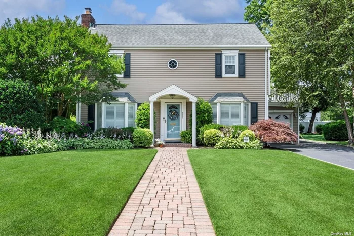 Discover Cathedral Gardens! Prepare to be surprised and delighted by this 3 br, 2.5 b true center hall colonial located mid-block on 65 x 165 beautifully landscaped property in Cathedral Gardens. The 1st fl offers a great circular flow featuring a LR w/gas fp and French doors that lead to a fabulous and inviting Family Room with vaulted ceiling and large bow window overlooking the park-like backyard, an eat-in kitchen w/ granite counters and banquet-size formal dining room. Upstairs is a luxurious ensuite primary bedroom with walk-in closet and private bath, 2 additional bedrooms and hall bath with skylight. A pull-down attic, basement and attached one-car garage complete the picture. The private patio and backyard are simply gorgeous! You are going to love coming home to this house!