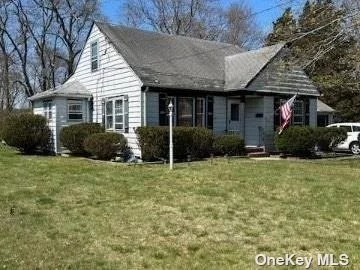 4 bed 2 bath Beloved Cape situated on sprawling lot in East Patchogue abuts town parkland. Electric, heating system and hot water heater updated in 2021. Make it your own.
