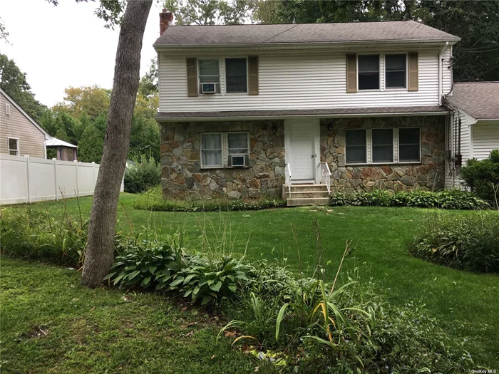 Lovely legal two-family home in Huntington. Two bedrooms over 2 bedrooms with a finished basement and 2-car garage. Tree-lined neighborhood. Large backyard. Live in one unit and rent the other.