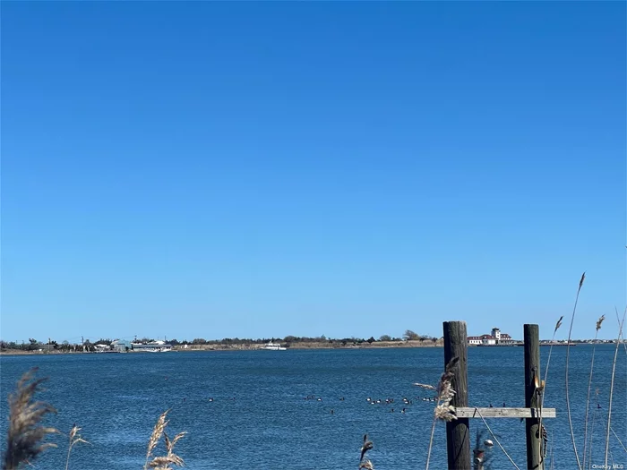 Spectacular, waterfront lot south of the highway in prestigious East Moriches. Incredible water views nestled on a half-acre. This is truly the spot to build your forever home! Board of health, DEC and pool permit will be delivered upon closing.