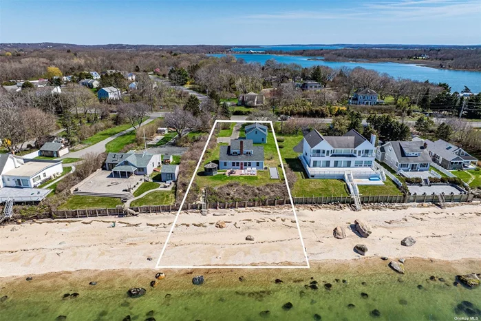 This great Greenport beach house is the one you&rsquo;ve been waiting for! Ten steps down to 100 feet of beach/ waterfront on the Long Island Sound. 4 bedrooms, 2 baths, 1 car attached and detached 2-car garage with a loft, screened in gazebo and a Bocce court on just shy of an acre! Plenty of room for a pool. This won&rsquo;t last! Near all the North Fork has to offer - award winning vineyards, renowned restaurants, farmstands, boating and great shopping!